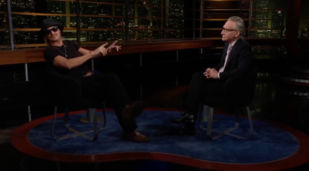 Bill Maher and Kid Rock sitting in chairs, discussing Kid Rock's opinion on Kendrick Lamar's Super Bowl show